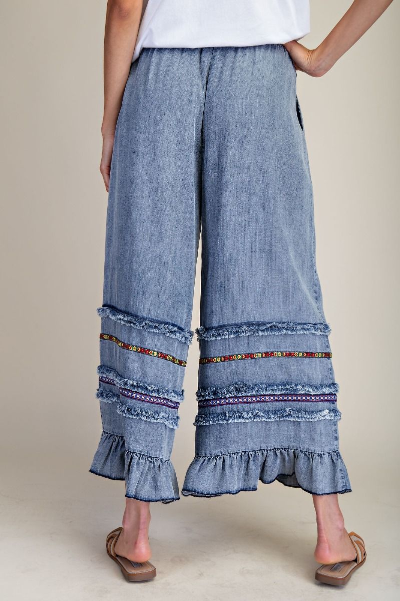 EASEL RUFFLE BOTTOM STONE WASHED CHAMBRAY PANTS